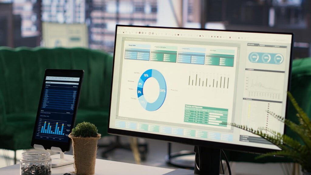A business intelligence dashboard on a screen showing various charts and graphs for data analysis.
